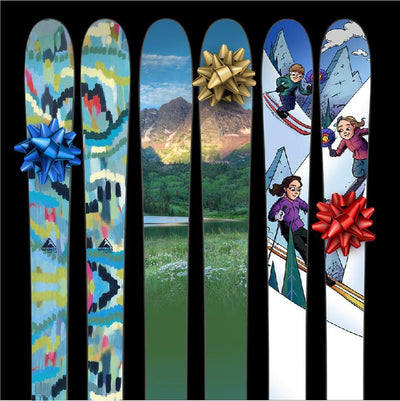 Wagner Custom skis with bows to give as gifts. One artist series ski, one mountain photograph ski, and one illustrated ski